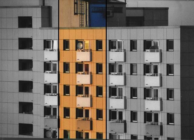 das bild zeigt ein hochhaus mit fokus auf die einzelnen wohnungen